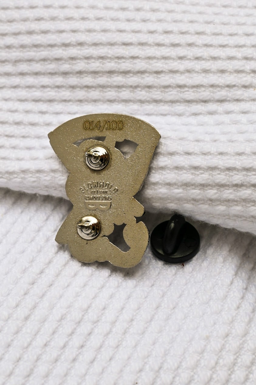 The Conflict Enamel Pin